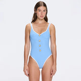 Azurea Underwired Gold Button Detail Blue Swimsuit | Moeva | Swimsuit | Each week unveils new pieces—luxury swimwear, fluid resort silhouettes, and elevated summer-to-evening essentials designed to carry you from coastal escapes to city nights.