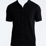 Lars Black Polo Shirt with Button Fastening | Moeva | Men Classic Collar Shirts | Each week unveils new pieces—luxury swimwear, fluid resort silhouettes, and elevated summer-to-evening essentials designed to carry you from coastal escapes to city nights.