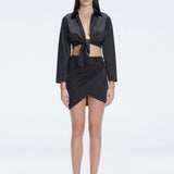 Greta Black Satin Long Sleeve Tie Front Shirt | Moeva | Shirt | Each week unveils new pieces—luxury swimwear, fluid resort silhouettes, and elevated summer-to-evening essentials designed to carry you from coastal escapes to city nights.