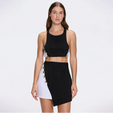 Riviera Black-White Duo-Colored Asymmetric Gold Button Mini Skort | Moeva | Skirt | Each week unveils new pieces—luxury swimwear, fluid resort silhouettes, and elevated summer-to-evening essentials designed to carry you from coastal escapes to city nights.