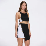 Riviera Black-White Duo-Colored Asymmetric Gold Button Mini Skort | Moeva | Skirt | Each week unveils new pieces—luxury swimwear, fluid resort silhouettes, and elevated summer-to-evening essentials designed to carry you from coastal escapes to city nights.