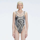 Calista Black Plunge Scoop Neck Swimsuit | Moeva | Swimsuit | Each week unveils new pieces—luxury swimwear, fluid resort silhouettes, and elevated summer-to-evening essentials designed to carry you from coastal escapes to city nights.