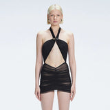 Carolina Black Cut-Out Halter Swimdress | Moeva | Swimsuit | Each week unveils new pieces—luxury swimwear, fluid resort silhouettes, and elevated summer-to-evening essentials designed to carry you from coastal escapes to city nights.