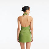 Clementine Green Halterneck Swimsuit with Tie-Front Skirt Detail | Moeva | Swimsuit | Each week unveils new pieces—luxury swimwear, fluid resort silhouettes, and elevated summer-to-evening essentials designed to carry you from coastal escapes to city nights.
