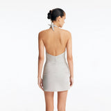 Clementine Silver Halterneck Swimsuit with Tie-Front Skirt Detail | Moeva | Swimsuit | Each week unveils new pieces—luxury swimwear, fluid resort silhouettes, and elevated summer-to-evening essentials designed to carry you from coastal escapes to city nights.