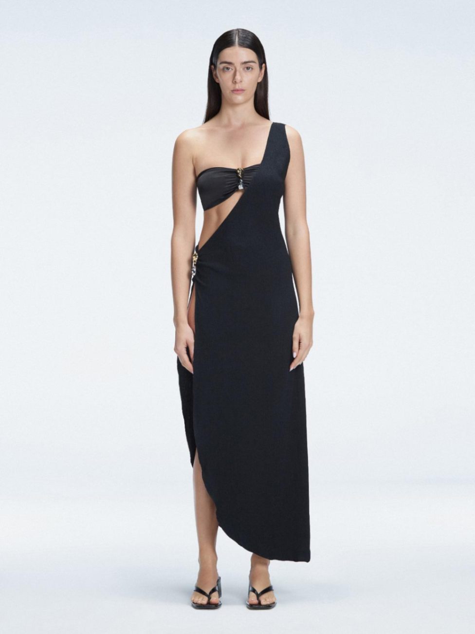 Front view of model wearing Coraline Black Dress with chic one-shoulder design and trendy buckle detail.