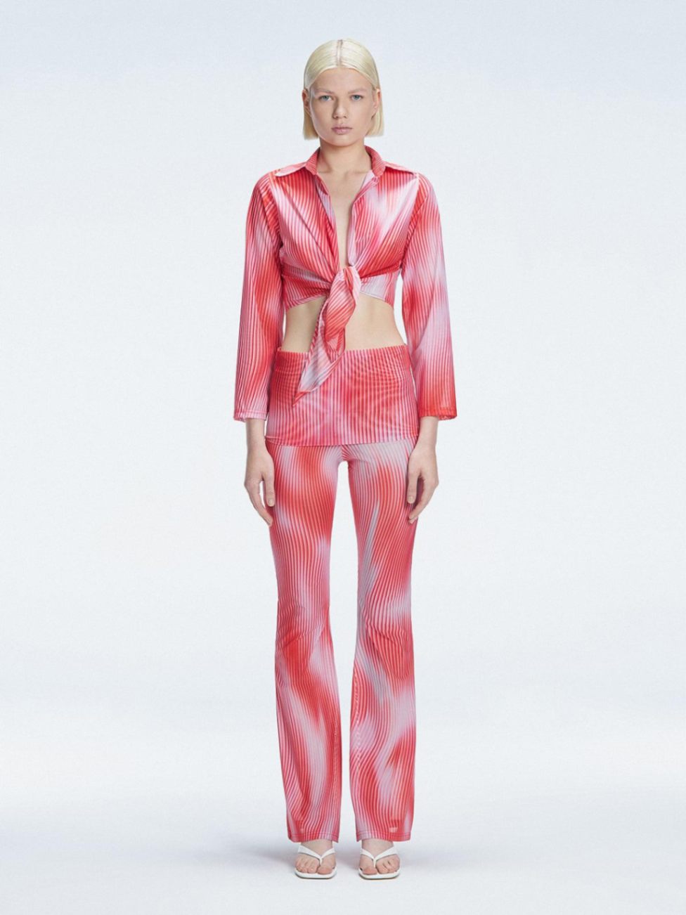Greta Red Long Sleeve Tie Front Shirt | Moeva | Top | Each week unveils new pieces—luxury swimwear, fluid resort silhouettes, and elevated summer-to-evening essentials designed to carry you from coastal escapes to city nights.