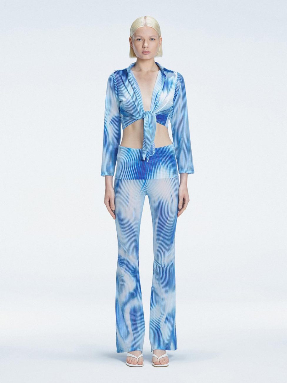 Greta Blue Long Sleeve Tie Front Shirt | Moeva | Top | Each week unveils new pieces—luxury swimwear, fluid resort silhouettes, and elevated summer-to-evening essentials designed to carry you from coastal escapes to city nights.