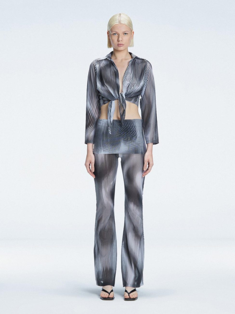 Greta Black Long Sleeve Tie Front Shirt | Moeva | Top | Each week unveils new pieces—luxury swimwear, fluid resort silhouettes, and elevated summer-to-evening essentials designed to carry you from coastal escapes to city nights.
