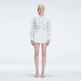 Elise White Linen Mini Skort | Moeva | Skort | Each week unveils new pieces—luxury swimwear, fluid resort silhouettes, and elevated summer-to-evening essentials designed to carry you from coastal escapes to city nights.
