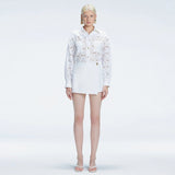 Elise White Linen Mini Skort | Moeva | Skort | Each week unveils new pieces—luxury swimwear, fluid resort silhouettes, and elevated summer-to-evening essentials designed to carry you from coastal escapes to city nights.