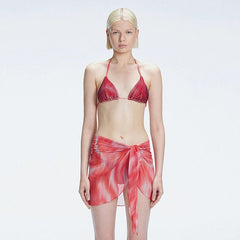 Evita Red Optical Tie Side Sarong | Moeva | Sarong | Each week unveils new pieces—luxury swimwear, fluid resort silhouettes, and elevated summer-to-evening essentials designed to carry you from coastal escapes to city nights.