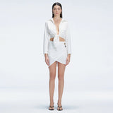 Greta White Long Sleeve Tie Front Shirt and Antonia White High-Waist Wrap Mini Skirt | Moeva | Set | Each week unveils new pieces—luxury swimwear, fluid resort silhouettes, and elevated summer-to-evening essentials designed to carry you from coastal escapes to city nights.