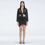 Greta Black Long Sleeve Tie Front Shirt and Antonia Black High-Waist Wrap Mini Skirt | Moeva | Set | Each week unveils new pieces—luxury swimwear, fluid resort silhouettes, and elevated summer-to-evening essentials designed to carry you from coastal escapes to city nights.