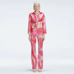 Greta Long Sleeve Tie Front Shirt and Freya High Waist Pants Red Optical Set | Moeva | Set | Each week unveils new pieces—luxury swimwear, fluid resort silhouettes, and elevated summer-to-evening essentials designed to carry you from coastal escapes to city nights.