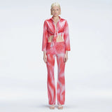 Greta Long Sleeve Tie Front Shirt and Freya High Waist Pants Red Optical Set | Moeva | Set | Each week unveils new pieces—luxury swimwear, fluid resort silhouettes, and elevated summer-to-evening essentials designed to carry you from coastal escapes to city nights.