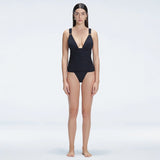 Griselda Black V-Neck Ruched Swimdress with Gold Detail | Moeva | Swimsuit | Each week unveils new pieces—luxury swimwear, fluid resort silhouettes, and elevated summer-to-evening essentials designed to carry you from coastal escapes to city nights.