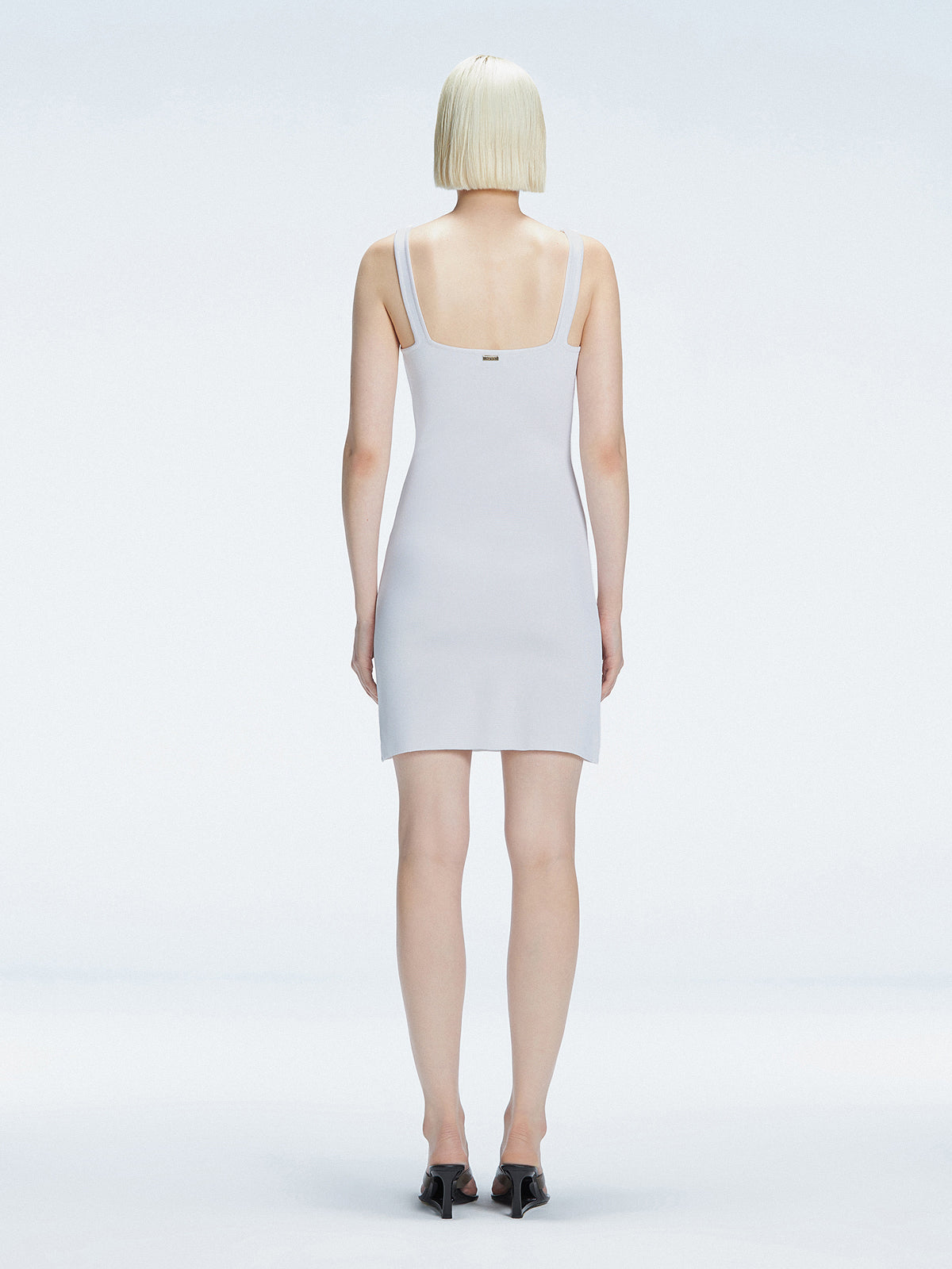 Heather Square Neck Knit Mini Dress Slit Detail | Moeva | Dress | Each week unveils new pieces—luxury swimwear, fluid resort silhouettes, and elevated summer-to-evening essentials designed to carry you from coastal escapes to city nights.