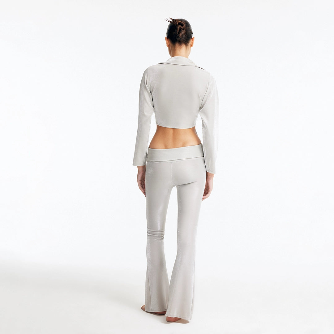Greta Silver Long Sleeve Tie Front Shirt and Izara Mid-Rise Flared Pants | Moeva | Set | Each week unveils new pieces—luxury swimwear, fluid resort silhouettes, and elevated summer-to-evening essentials designed to carry you from coastal escapes to city nights.