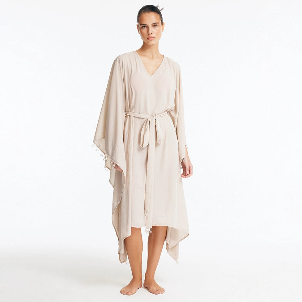 Bethany Silver V Neck Belted Silk Kaftan | Moeva | Kaftan | Each week unveils new pieces—luxury swimwear, fluid resort silhouettes, and elevated summer-to-evening essentials designed to carry you from coastal escapes to city nights.