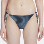 Hermione Black Side Tie 3D Bikini Bottom | Moeva | Bikini Bottom | Each week unveils new pieces—luxury swimwear, fluid resort silhouettes, and elevated summer-to-evening essentials designed to carry you from coastal escapes to city nights.