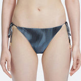 Hermione Black Side Tie 3D Bikini Bottom | Moeva | Bikini Bottom | Each week unveils new pieces—luxury swimwear, fluid resort silhouettes, and elevated summer-to-evening essentials designed to carry you from coastal escapes to city nights.
