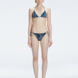 Hermione Black Side Tie 3D Bikini Bottom | Moeva | Bikini Bottom | Each week unveils new pieces—luxury swimwear, fluid resort silhouettes, and elevated summer-to-evening essentials designed to carry you from coastal escapes to city nights.