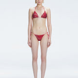 Front view of model wearing Hermione Red Optical Bikini Set with triangle shape and 3D printed design.