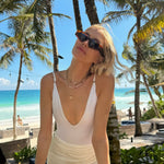 Lena Perminova - Greta White Long Sleeve Tie Front Shirt And Antonia Satin White High-Waist Wrap Mini Skirt | Moeva | Set | Each week unveils new pieces—luxury swimwear, fluid resort silhouettes, and elevated summer-to-evening essentials designed to carry you from coastal escapes to city nights.