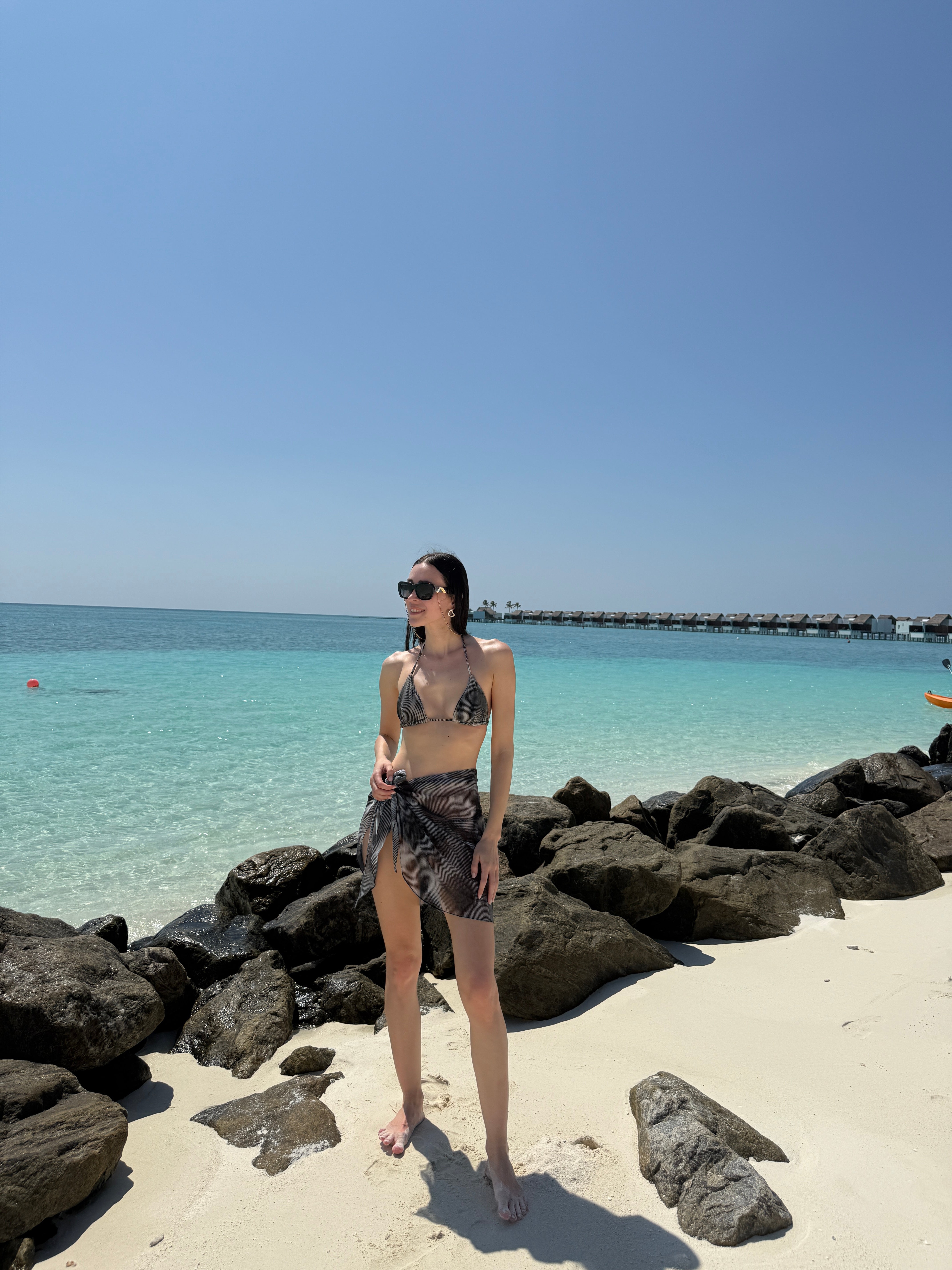 Elvira Jain - Hermione Black Triangle Side Tie 3D Bikini Set - Evita Black Optical Tie Side Sarong | Moeva | | Each week unveils new pieces—luxury swimwear, fluid resort silhouettes, and elevated summer-to-evening essentials designed to carry you from coastal escapes to city nights.