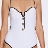 Lourmarin White Underwired Gold Button Detail Swimsuit | Moeva | Swimsuit | Each week unveils new pieces—luxury swimwear, fluid resort silhouettes, and elevated summer-to-evening essentials designed to carry you from coastal escapes to city nights.