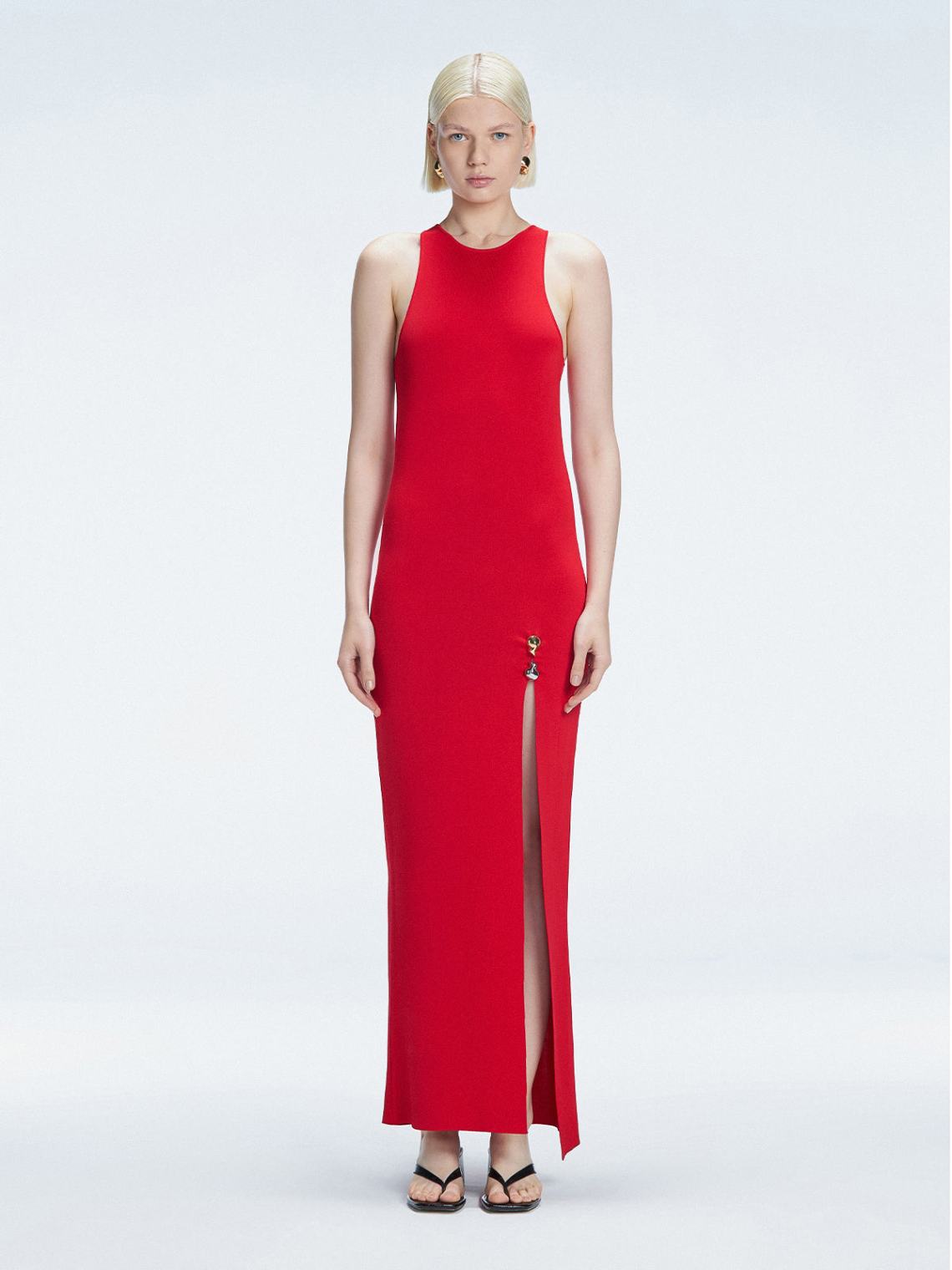 Front view of model wearing Louisa Red Maxi Dress with high neck, sleeveless design, and buckle detail.