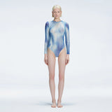 Mireya Blue Optical Long Sleeve Bodysuit | Moeva | One-Piece | Each week unveils new pieces—luxury swimwear, fluid resort silhouettes, and elevated summer-to-evening essentials designed to carry you from coastal escapes to city nights.