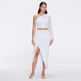Monroe White One-Shoulder Knit Top with Fringe & Mesh Sleeve | Moeva | RTW Bustiers | Each week unveils new pieces—luxury swimwear, fluid resort silhouettes, and elevated summer-to-evening essentials designed to carry you from coastal escapes to city nights.