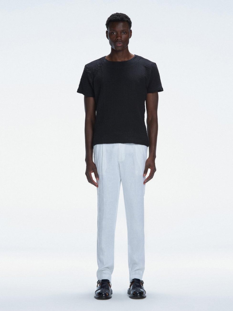 George Black Cotton T-Shirt with Button Detail | Moeva | Men Round Neck Shirts | Each week unveils new pieces—luxury swimwear, fluid resort silhouettes, and elevated summer-to-evening essentials designed to carry you from coastal escapes to city nights.
