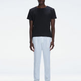 George Black Cotton T-Shirt with Button Detail | Moeva | Men Round Neck Shirts | Each week unveils new pieces—luxury swimwear, fluid resort silhouettes, and elevated summer-to-evening essentials designed to carry you from coastal escapes to city nights.