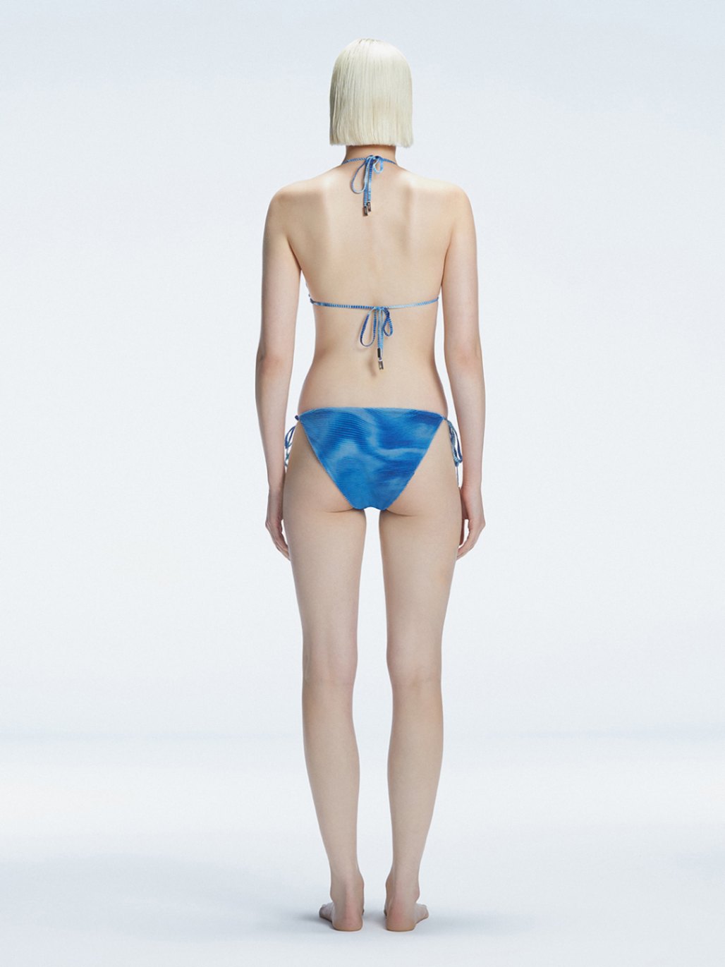 Hermione Blue Side Tie 3D Bikini Bottom | Moeva | Bikini Bottom | Each week unveils new pieces—luxury swimwear, fluid resort silhouettes, and elevated summer-to-evening essentials designed to carry you from coastal escapes to city nights.