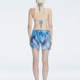 Evita Blue Optical Tie Side Sarong | Moeva | Sarong | Each week unveils new pieces—luxury swimwear, fluid resort silhouettes, and elevated summer-to-evening essentials designed to carry you from coastal escapes to city nights.
