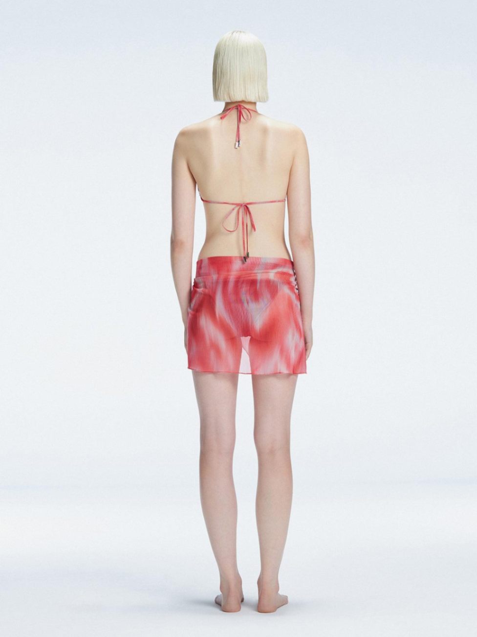 Evita Red Optical Tie Side Sarong | Moeva | Sarong | Each week unveils new pieces—luxury swimwear, fluid resort silhouettes, and elevated summer-to-evening essentials designed to carry you from coastal escapes to city nights.