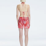 Evita Red Optical Tie Side Sarong | Moeva | Sarong | Each week unveils new pieces—luxury swimwear, fluid resort silhouettes, and elevated summer-to-evening essentials designed to carry you from coastal escapes to city nights.