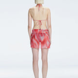 Evita Red Optical Tie Side Sarong | Moeva | Sarong | Each week unveils new pieces—luxury swimwear, fluid resort silhouettes, and elevated summer-to-evening essentials designed to carry you from coastal escapes to city nights.
