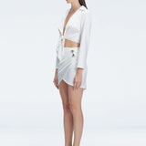 Greta Satin White Long Sleeve Tie Front Shirt | Moeva | Shirt | Each week unveils new pieces—luxury swimwear, fluid resort silhouettes, and elevated summer-to-evening essentials designed to carry you from coastal escapes to city nights.