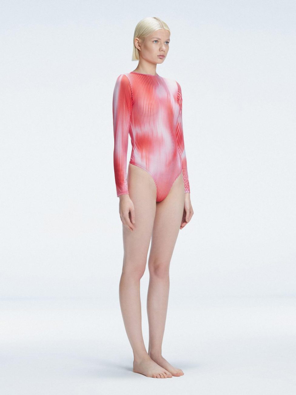 Mireya Red Optical Long Sleeve Bodysuit | Moeva | One-Piece | Each week unveils new pieces—luxury swimwear, fluid resort silhouettes, and elevated summer-to-evening essentials designed to carry you from coastal escapes to city nights.