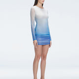 Sylvie Blue Optical Long Sleeve Mini Dress | Moeva | Beachwear Dresses | Each week unveils new pieces—luxury swimwear, fluid resort silhouettes, and elevated summer-to-evening essentials designed to carry you from coastal escapes to city nights.