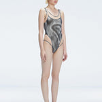 Calista Black Plunge Scoop Neck Swimsuit | Moeva | Swimsuit | Each week unveils new pieces—luxury swimwear, fluid resort silhouettes, and elevated summer-to-evening essentials designed to carry you from coastal escapes to city nights.