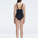 Griselda Black V-Neck Ruched Swimdress with Gold Detail | Moeva | One-Piece | Each week unveils new pieces—luxury swimwear, fluid resort silhouettes, and elevated summer-to-evening essentials designed to carry you from coastal escapes to city nights.