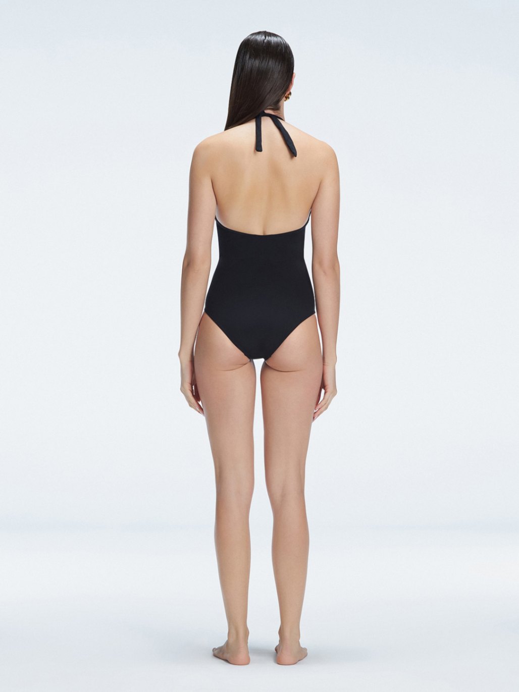 Miley Black Halter Swimsuit | Moeva | One-Piece | Each week unveils new pieces—luxury swimwear, fluid resort silhouettes, and elevated summer-to-evening essentials designed to carry you from coastal escapes to city nights.