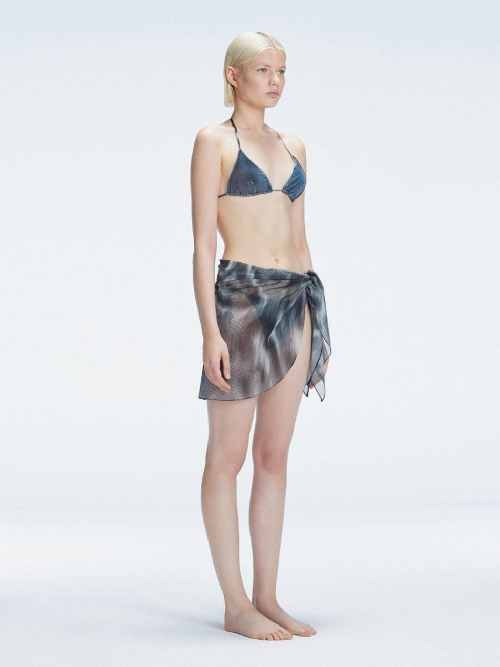 Evita Black Optical Tie Side Sarong | Moeva | Sarong | Each week unveils new pieces—luxury swimwear, fluid resort silhouettes, and elevated summer-to-evening essentials designed to carry you from coastal escapes to city nights.