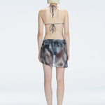 Evita Black Optical Tie Side Sarong | Moeva | Sarong | Each week unveils new pieces—luxury swimwear, fluid resort silhouettes, and elevated summer-to-evening essentials designed to carry you from coastal escapes to city nights.