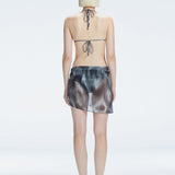 Evita Black Optical Tie Side Sarong | Moeva | Sarong | Each week unveils new pieces—luxury swimwear, fluid resort silhouettes, and elevated summer-to-evening essentials designed to carry you from coastal escapes to city nights.